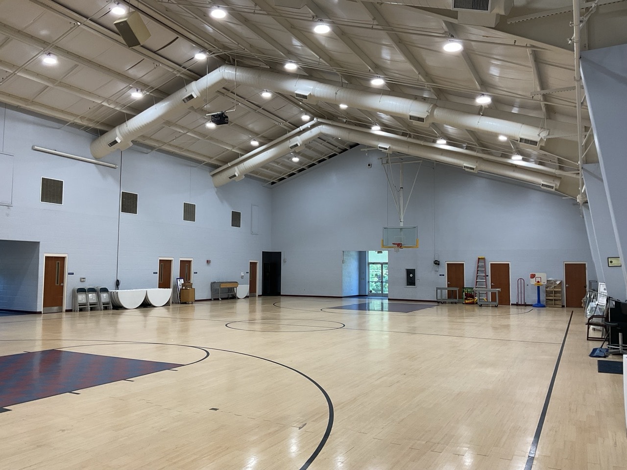 Large recreation facility gymnasium with bright LED high-bay lighting installed by DTL Energy Solutions