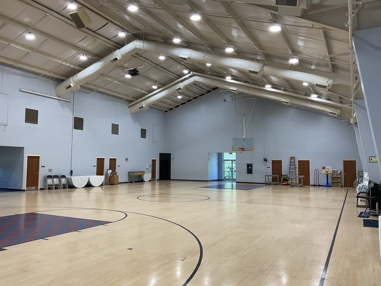 Large recreation facility gymnasium upgraded with bright LED high-bay lighting
